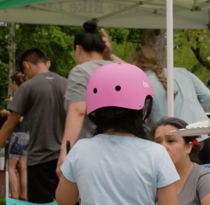 A neighborhood gathering with folks learning to bike!